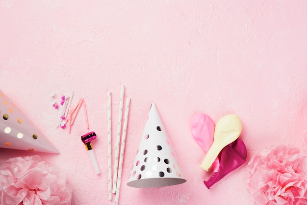 Top view frame with decorations on pink background