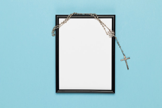 Free photo top view frame with holy necklace