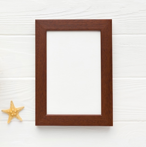 Top view frame with starfish on the table