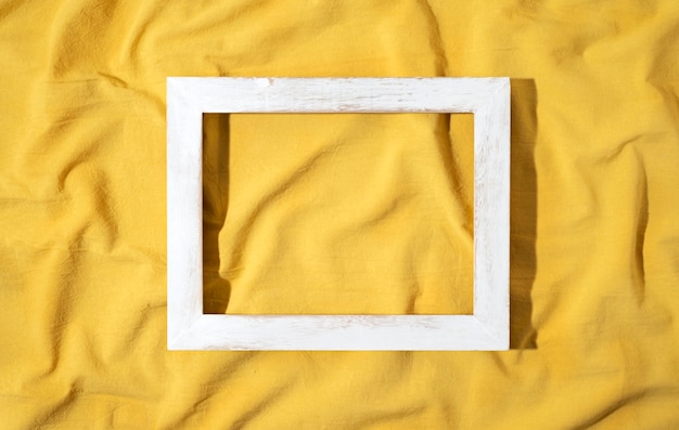 Free Photo top view frame on yellow cloth