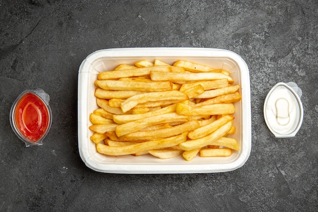 Top view of french fries with delicious ketchup