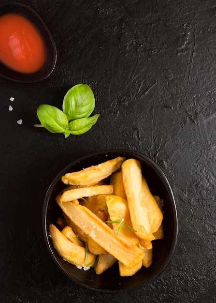 Free Photo top view of french fries with ketchup sauce and salt