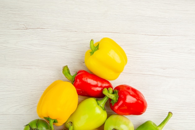 Top view fresh bell-peppers different colored on the white background ripe  meal salad color