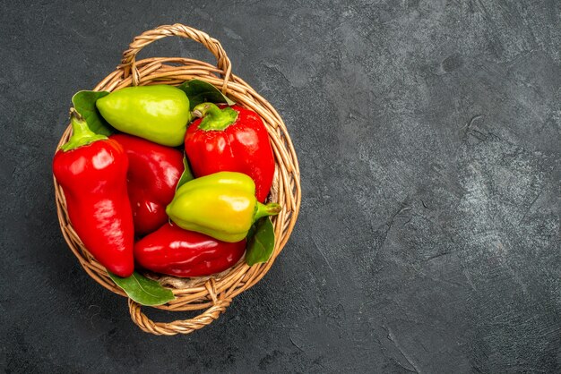 Top view fresh bell-peppers inside basket