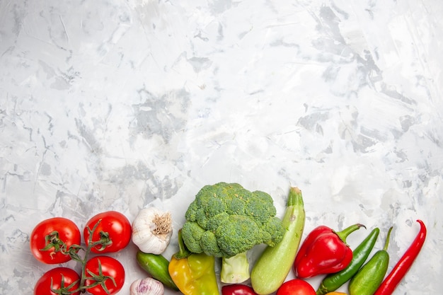 Free photo top view fresh broccoli with vegetables on white floor diet salad ripe health