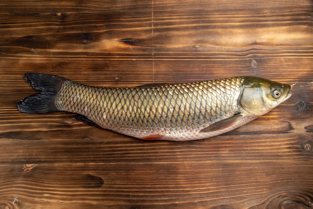 Top view fresh fish raw product on wooden table fish sea meat ocean food