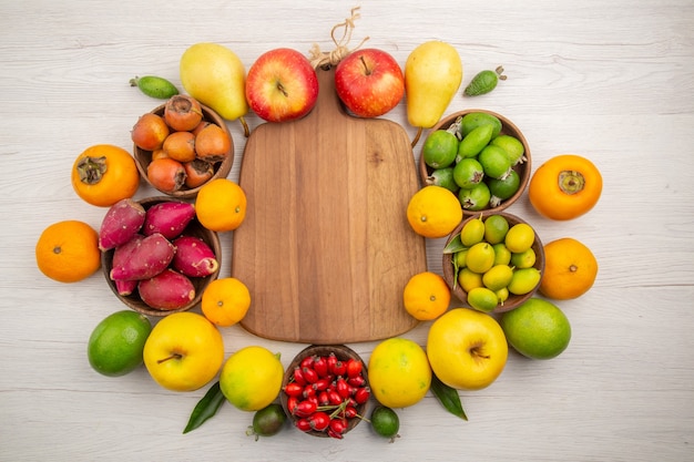 Top view fresh fruits composition different fruits on a white background