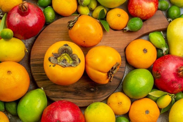 Top view fresh fruits different mellow fruits on white background color diet  tasty health ripe tree