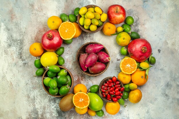 Top view fresh fruits different mellow fruits on white background health tree color  berry citrus ripe tasty