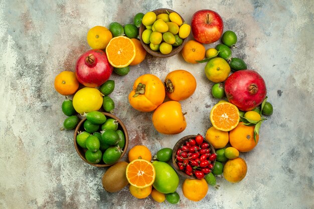 Top view fresh fruits different mellow fruits on a white background health tree color photo berry citrus ripe tasty