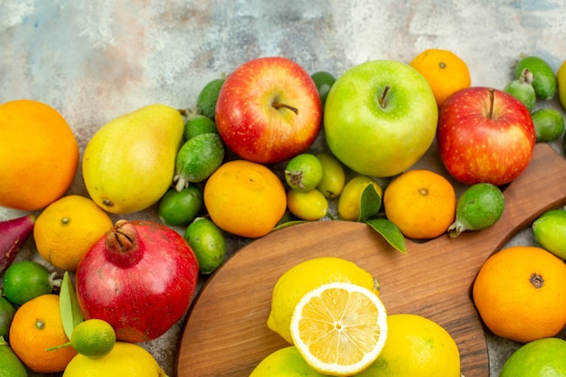 Top view fresh fruits different ripe and mellow fruits on white background berry color health diet tasty