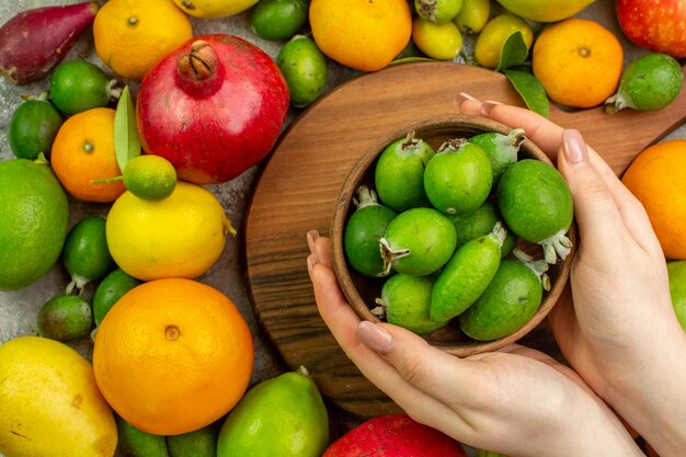 Top view fresh fruits different ripe and mellow fruits on white background berry color tasty photo health diet