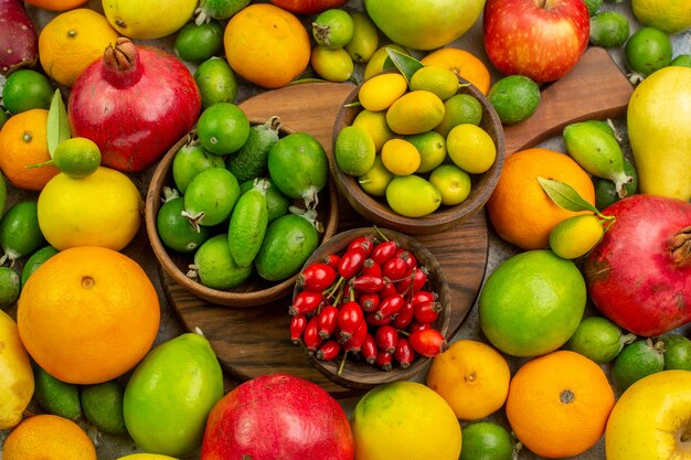 Top view fresh fruits different ripe and mellow fruits on a white background berry  tasty health color diet