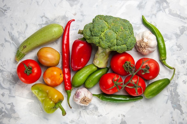 Top view fresh green broccoli with vegetables on white table salad ripe health diet