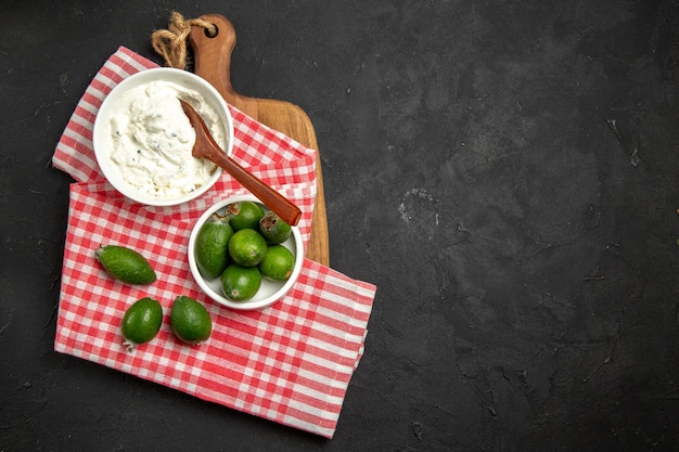 Top view fresh green feijoa with cream on a dark surface fruit exotic health mellowa