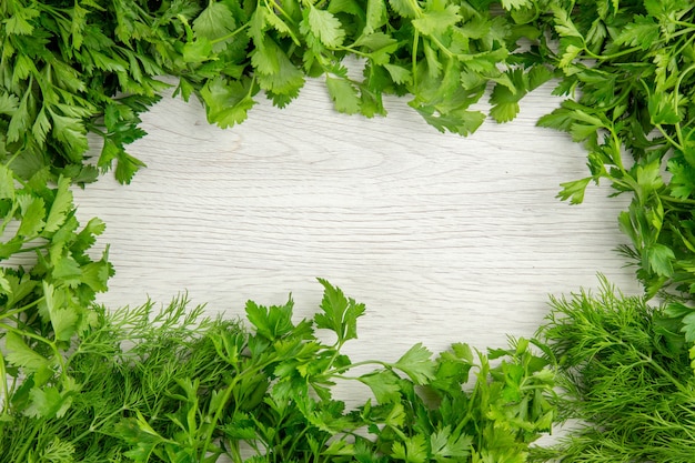 Free photo top view fresh greens on white background