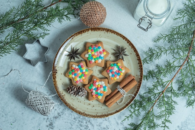 Top view of fresh homemade cookies on plate over white.