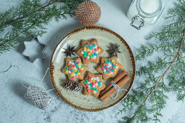 Top view of fresh homemade cookies on plate over white.