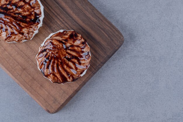 Top view of fresh homemade cookies on wooden board