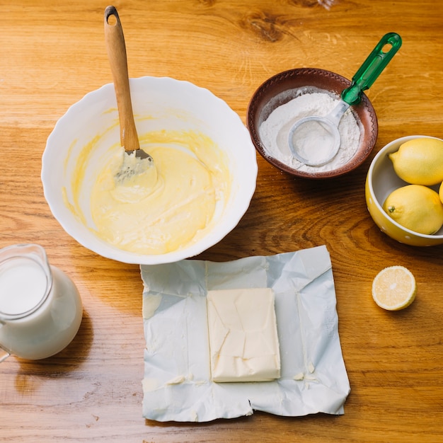 Top view of fresh ingredients for making pie on wooden table