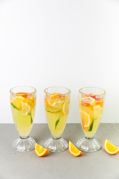 Free photo top view fresh lemonade glasses