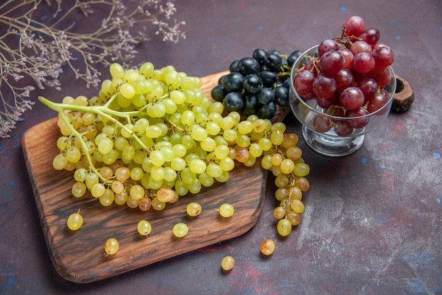 Top view fresh mellow grapes on the dark surface wine fresh grape fruit tree plant ripe