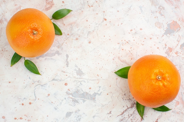 Free Photo top view fresh oranges on bright isolated surface with free space