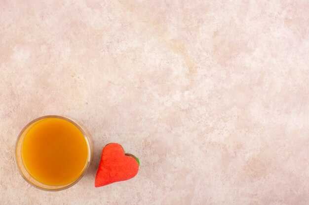 A top view fresh peach juice sweet and delicious with colorful cookies