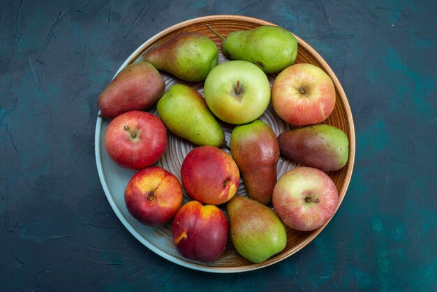 Top view fresh pears with apples on the dark-blue desk fruit fresh mellow ripe sweet