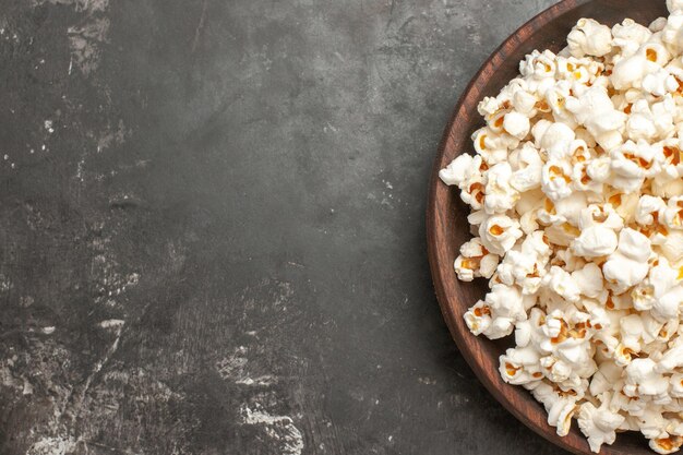 Top view fresh popcorn on dark background