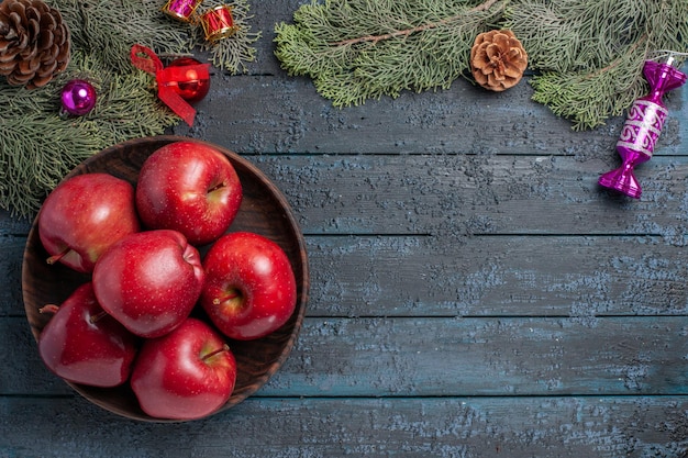 Top view fresh red apples mellow ripe fruits on the dark-blue desk plant many fruit vitamine tree red fresh color