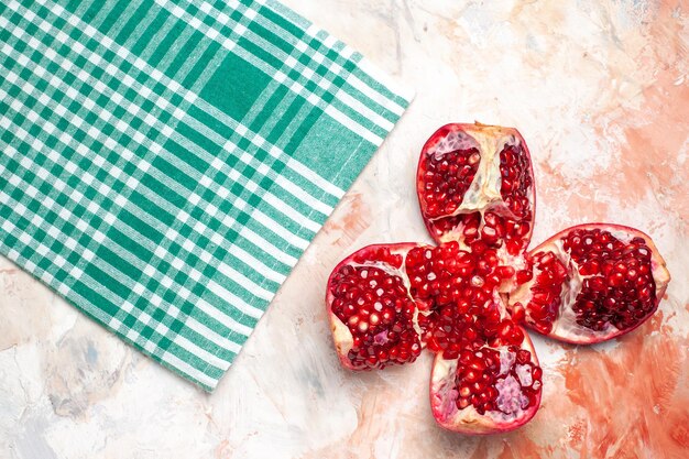 Top view fresh red pomegranates on light background