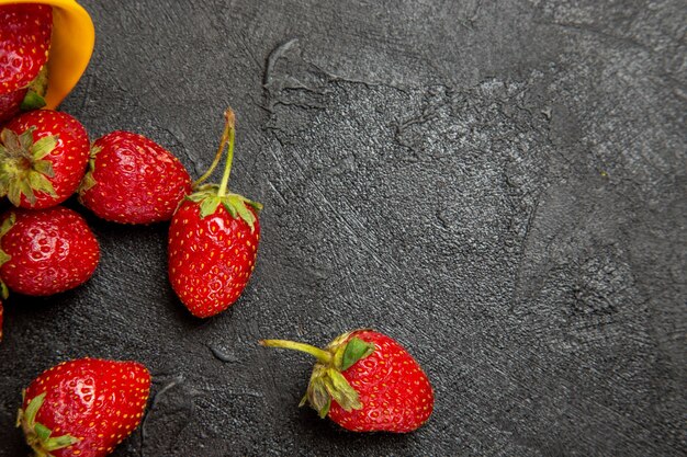 Top view fresh red strawberries on dark floor fruit berry ripe