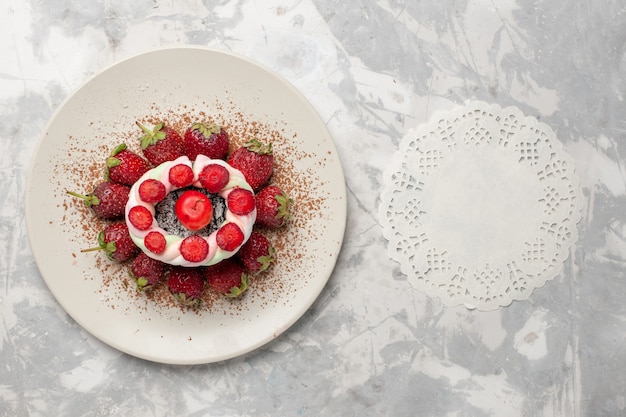 Top view fresh red strawberries with cake on white desk