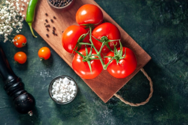 top view fresh red tomatoes on a dark surface vegetable fresh meal pepper color ripe salad food