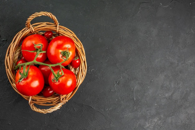 Top view fresh red tomatoes inside basket