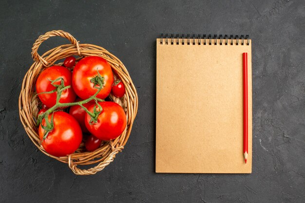 Top view fresh red tomatoes inside basket