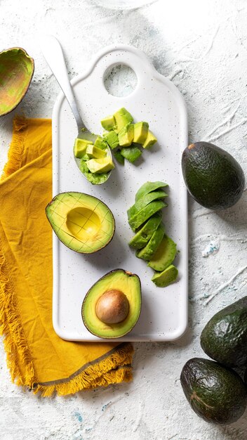 Top view of fresh ripe avocado on a white board