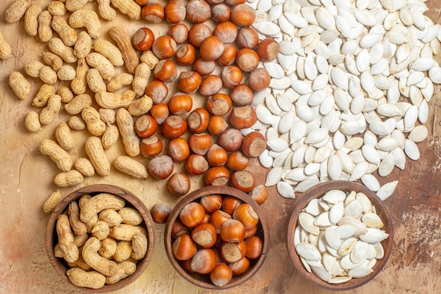 Top view of fresh seeds lined on a wooden desk