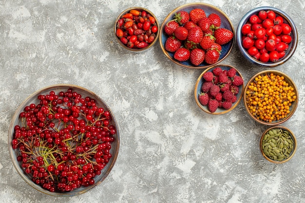 Top view fresh strawberries with red berries on white background