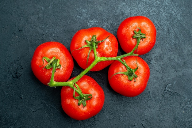 Top view fresh tomatoes on dark table