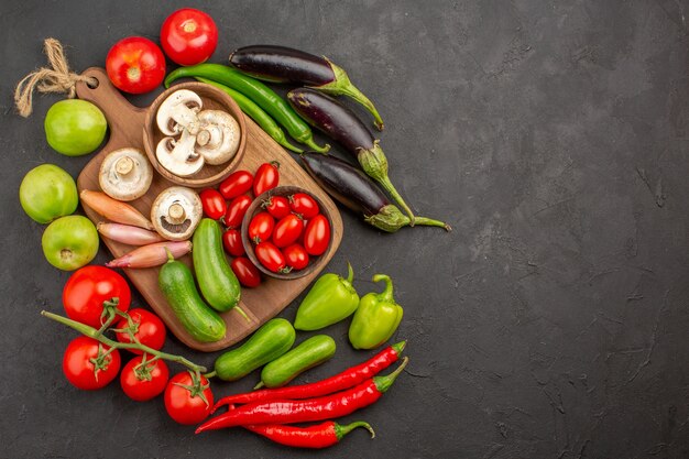 Top view fresh vegetables composition on the dark background