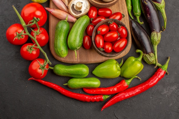 Free photo top view fresh vegetables composition on grey background