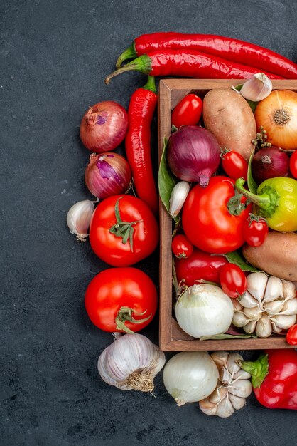 Top view fresh vegetables composition on grey floor salad fresh ripe color