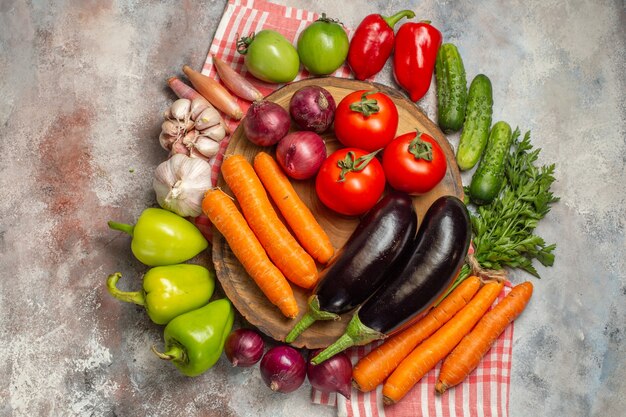 Top view fresh vegetables composition on a white background