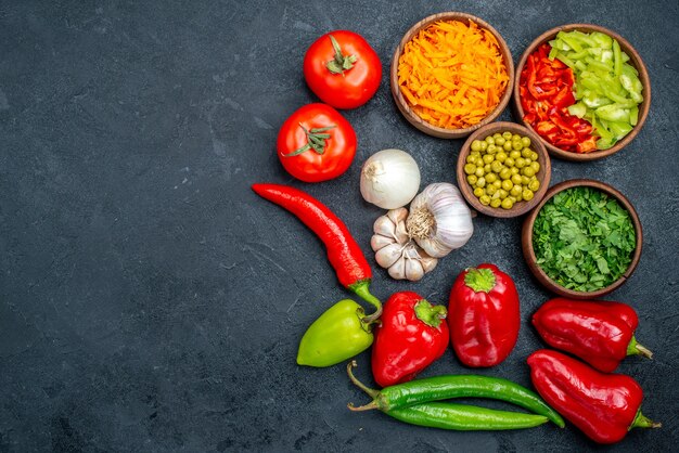 Top view fresh vegetables with garlic on dark table salad meal ripe color