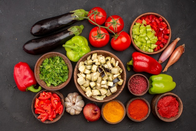 Top view fresh vegetables with greens and different seasonings on grey wall meal salad health food vegetable