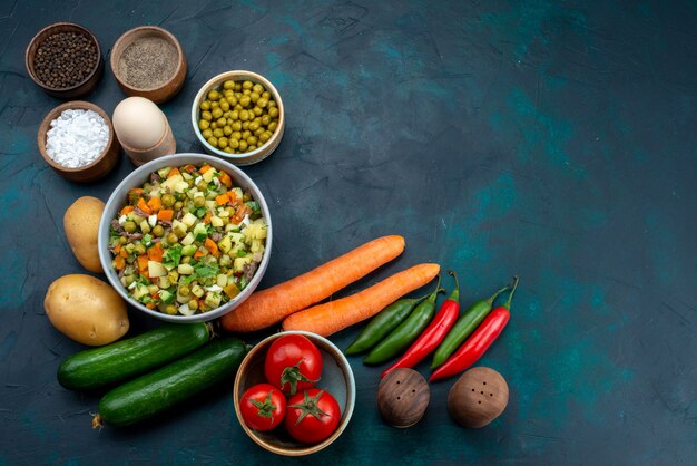 Top view fresh vegetables with greens and salad on the blue desk lunch salad snack vegetable food