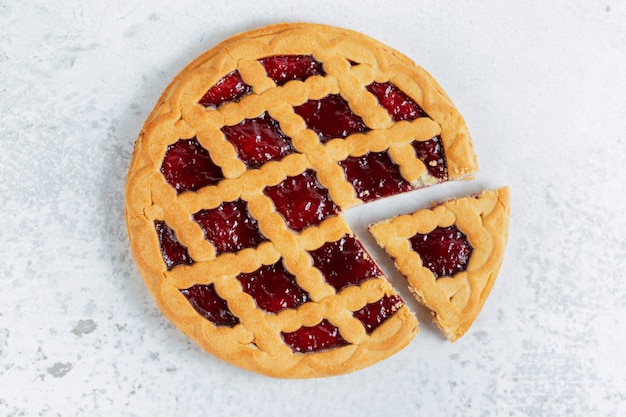 Free photo top view of freshly baked homemade american pie on grey surface.