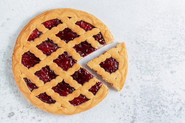 Free photo top view of freshly baked homemade american pie on grey wall.